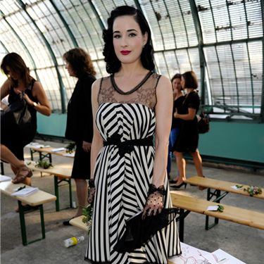 Burlesque Dita Von Teese was in Paris yesterday for the front row of Alexis Mabille Ready to Wear Spring/Summer 2012 with beau Louis-Marie de Castelbaja. She mixed monochrome stripes and lace more stylishly than anyone else ever could!