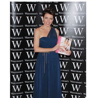 The evening of the floral dress disaster, Dannii has certainly upped the style stakes. This navy draped dress work at her book launch for Waterstone's, looks amazing on her, and she looks super confident!  Dannii has certainly experimented with fashion throughout the years, and we reckon she's found her unique style
