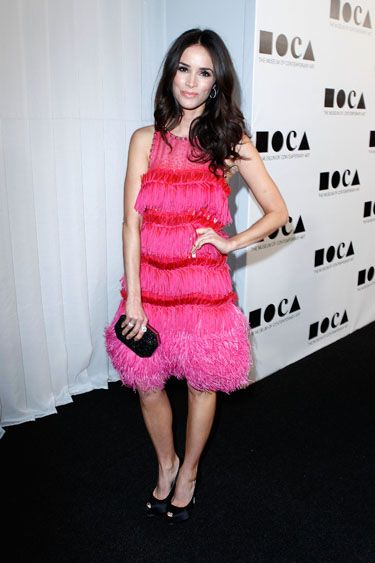 The beautiful star of Mad Men and Hollywood flick Cowboys Vs Aliens sparkled in an electric pink dress that could easily fit into a Chicago musical medley.