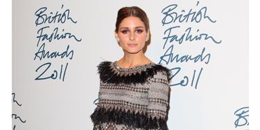 <p>Designer styles were expected all round at this year's British Fashion Awards in London, and while Olivia hit the ceremony in a fabulous fringe and bead embellished dress by Matthew Williamson, she decided to team it with a high street steal: a fierce pair of tiger stripe heels from Topshop. Grr-eat! </p>