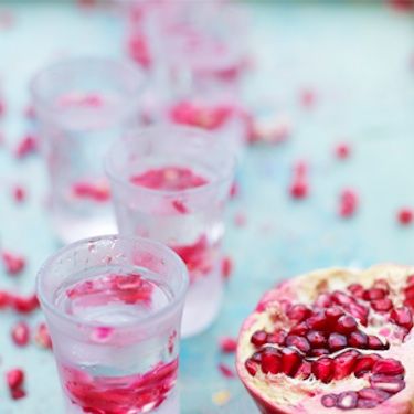 <p>Try this scrummy Christmas cocktail; first up, op a bottle of good-quality tequila in the freezer for an hour, along with a shot glass for each of your guests. Cut two pomegranates in half and take their seeds out. Fill your shot glasses with pomegranate seeds, pour in your iced tequila and,  depending on your own unique style, sip it or knock it back. But DON'T swallow until you've crunched the pomegranate seeds because they add a real burst of fragrance and flavour in your mouth. Delicious!</p>

<p>See this, as well as plenty of other festive recipes, at the official <a href="http://www.jamieoliver.com/recipes/fruit-recipes/christmas-spirit-cocktail">Jamie Oliver website</a></p>
