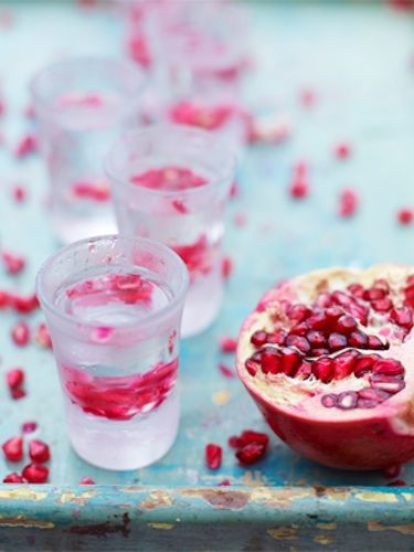 <p>Try this scrummy Christmas cocktail; first up, op a bottle of good-quality tequila in the freezer for an hour, along with a shot glass for each of your guests. Cut two pomegranates in half and take their seeds out. Fill your shot glasses with pomegranate seeds, pour in your iced tequila and,  depending on your own unique style, sip it or knock it back. But DON'T swallow until you've crunched the pomegranate seeds because they add a real burst of fragrance and flavour in your mouth. Delicious!</p>

<p>See this, as well as plenty of other festive recipes, at the official <a href="http://www.jamieoliver.com/recipes/fruit-recipes/christmas-spirit-cocktail">Jamie Oliver website</a></p>
