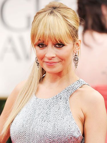 Wow! Nicole Richie really turned on the glamour at the Golden Globes. She teamed her metallic gown with heavy eye liner, a full fringe and the best ponytail we've ever seen. The rest of her makeup was kept simple, going for the less-is-more approach