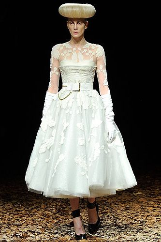 <p><strong>Rickie:</strong> Is this a wedding dress? It looks great minus the halo looking fringe<br /><strong></strong></p>
<p><strong>Melvin:</strong> Hmm not sure what's going on with the hair but I like the dress, it's cute.</p>
<p><strong>Cosmo:</strong> Fashion moment alert! Kristen McMenany on the catwalk for McQ was fashion history in the making. A dreamy autumnal backdrop and heavenly dresses made this a show to remember. And yup, we reckon there will be a fair few brides-to-be ordering this for their big day!</p>