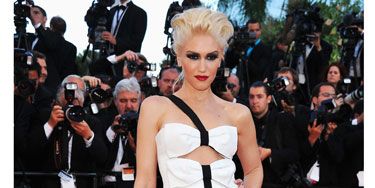 <p>Gwen Stefani went for monochrome in this peek-a-boo Armani Prive gown with bow detailing. The signer's beauty look was all about an extreme smoky eye teamed with her trademark red lippy</p>