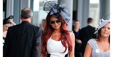 <p>Amy Childs has hit the big time - the 2012 Royal Ascot races. Here she is in a black and white, figure hugging dress from her own collection, which she has teamed with a glowing tan and peep-toe shoes. But is she sticking to the rules? Hmm, we're not so sure!</p>