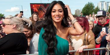 <p>Here's Nicole Scherzinger on the first day of her new X Factor judging job. Like us mere mortals, we bet Nicole was nervous on her first day. But she shouldn't have worried because she looked gorgeous in her emerald green frock and metallic peep-toe shoes. We can't wait to see how she copes with sitting next to Louis Walsh…<br /><br /></p>