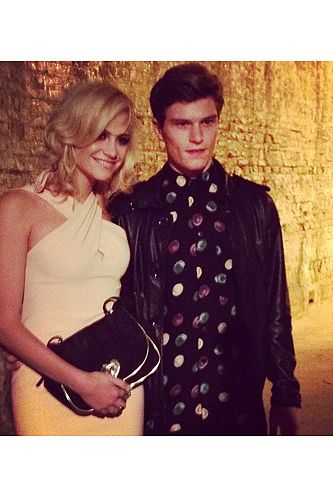 <p>Pixie Lott and her boyfriend Oliver Cheshire make a gorgeous pair, don't they? The two of them took their seat at the Moschino Cheap and Chic show looking adorable - and they couldn't keep their hands off one another.</p>