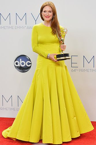 <p>Academy award nominated actress Julianne Moore won her first Emmy award for best actress in miniseries/movie for her brilliant performance as Sarah Palin in Game Change. She wore a gorgeous full-length yellow Dior couture dress with a radiant winner's smile. Congrats!</p>