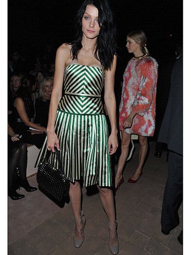 <p>After catching Jessica Stam at that Lady Gaga party, it's pretty clear she's become one of fashion's elite. She showed up front row at the Valentino show wearing a metallic green striped dress that really gave us an eye teaser with all those lines! We're not sure this was the best outfit to wear at Paris Fashion Week, but it definitely stood out of the black on black uniform we've seen so far!</p>
