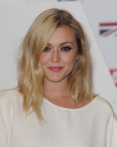 <p><strong>Why we love it</strong>: We're glad Fearne Cotton is keeping her golden blonde hair throughout the winter. She showed up at the UK's Creative Industries Reception at Royal Academy of Arts leaving her darker blonde roots out, giving her an all-around glow.</p>
<p><strong>What to ask your hairdresser</strong>: "Warm the hair tones up with some fresh highlights using the new Clynol bleaching system," advises Jason Cocking, art director of <a href="http://www.lisashepherd.co.uk/" target="_blank">Lisa Shepherd salon</a>. "Once the initial bleaching has taken place, add a gold toner to produce a warm golden finish."</p>
<p><strong>Pro style tip</strong>: "To achieve the final look, blow-dry with <a href="http://www.clynol.com/clynol/en/en/home/we-create/hair-styling/finish/uphold-hairspray.html" target="_blank">Clynol Uphold Hairspray, £6.90</a>, and then twist the hair and add a sprinkle of <a href="http://www.clynol.com/clynol/en/en/home/we-create/hair-styling/texture/powder-punch-powder.html" target="_blank">Clynol Powder Punch Powder, £10</a>, to give the hair a great texture," says Jason.</p>