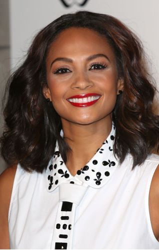<p>Ooh, we loved Alesha Dixon's smooth wavy hair at the Cosmopolitan Ultimate Women of the Year awards at Victoria & Albert museum. She paired it with a brilliant red lip for that ultra catty beauty look we love so much. To get the look, scrunch in some <a href="http://female.vo5.co.uk/products/smoothly-does-it/#curl-defining-mousse" target="_blank">Vo5 Curl Defining Mousse</a> to score these amazing curls without the frizz.</p>
