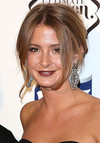 <p>Made in Chelsea beauty buff Millie Mack obviously rocked another pretty chignon on the red carpet of the Cosmopolitan Ultimate Women of the Year awards. She let her fringe out to frame her face and make the hairstyle more playful. She paired it with a super trendy dark burgundy lip and a soft smokey eye. Nailed it!</p>