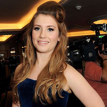 <p>X factor contestant Ella Henderson attended a drinks reception at the Amy Winehouse Foundation Ball in London rocking a gorgeous vintage hairstyle. She wore her hair in soft waves and tied up her fringe in an awesome victory roll. She was definitely channelling Amy Whinehouse with this retro hairstyle and fierce cat-eye makeup! </p>