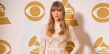 <p>Wowser - Taylor Swift looked fantastic in a lovely white lace dress! Paired with nude shoes and a winning smile, she walked away with three nominations for the 2013 Grammy awards - you go girl!</p>