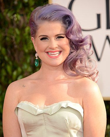 <p>Side-swept hairstyles were the hot topic on the 2013 Golden Globe Awards red carpet. Kelly Osbourne showed off her signature purple-grey locks in glossy, smooth waves. She parted her hair off to to one side to really show off this alluring hairstyle. Paired with a peachy-pink lipstick and plenty of mascara, we thought she couldn't have looked better!</p>