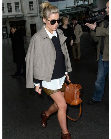 <p>Ooh, look! Mollie King is doing the Victoria Beckham-coat-on-shoulders thing - and she's working it! This outfit is very different for Mollie; it's almost preppy. We gotta say, we love her for trying out a new look. The Saturdays babe was leaving the BBC Radio One studios in London, but brrr, are those bare legs?</p>