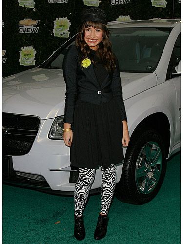<p>Rewind five years and we can see that Demi has always had great style. The zebra leggings keep the outfit looking young and fun. The fact she's at an event involving cars, the chauffeur-esque hat is the perfect accessory. Cute!</p>