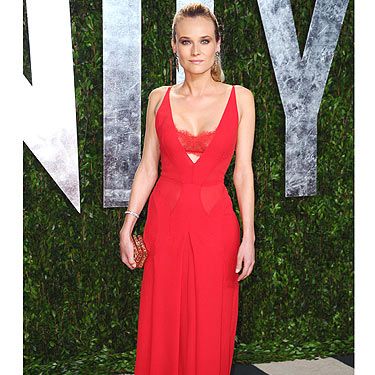 <p>Diane Kruger went for the slink-factor in this lipstick-red <span class="st"> Atelier Versace</span> gown with peek-a-boo cut-out section just below the bust</p>