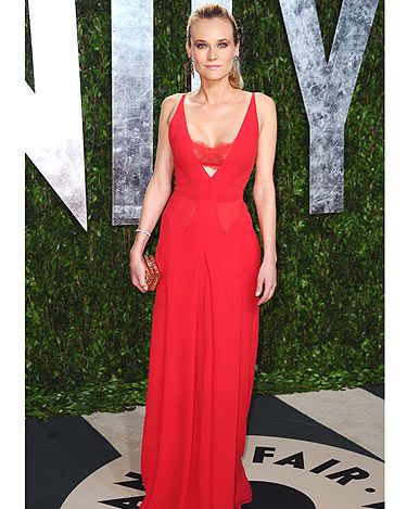 <p>Diane Kruger went for the slink-factor in this lipstick-red <span class="st"> Atelier Versace</span> gown with peek-a-boo cut-out section just below the bust</p>