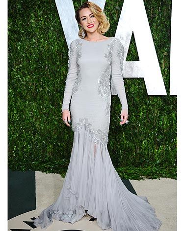 <p>Miley Cyrus went for old school Hollywood glamour for the Vanity Fair post Oscars party. From the sweeping train to her red lipstick and bouffant bob, she could have stepped straight out of Marilyn Monroe's wardrobe!</p>