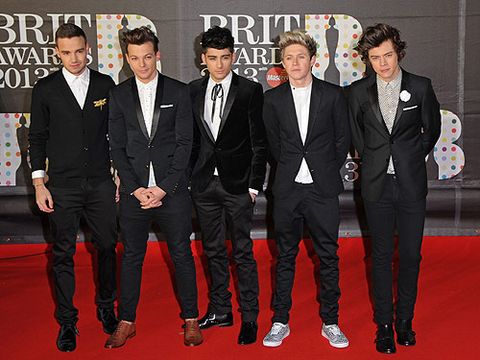 <p>One Direction has been nominated for Best Group at the Brit Awards 2013, so it's no surprise the boys arrived with big smiles on their faces. Our Cosmo cover stars all opted for slightly different looks. Liam chose a cardigan, while Zayn went for texture in velvet and ribbon. On the footwear front, Louis was the only one in brown shoes, and Niall made his look casual with trainers. Harry Styles, the Lothario of the group, chose a printed shirt and corsage. It doesn't matter what the 1D boys wear to us, even their birthday suits would be completely acceptable.</p>