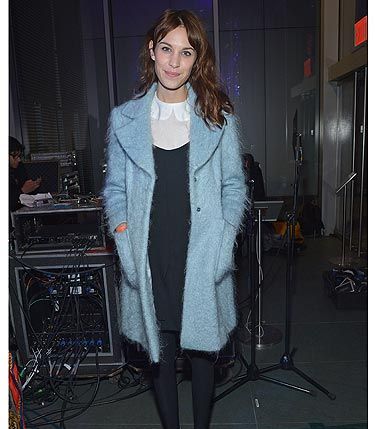 Sigh. We want to BE Alexa Chung, the girl has an impressive wardrobe. The style maven pulled off the winter pastel trend with minimal effort in a powder blue winter coat at the The Armory Party at MOMA. She teamed her coat with her outfit de rigueur; a white Peter Pan collar blouse, LBD and a pair of black platform shoes. Perfect.