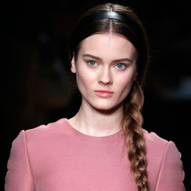 <p>The simple side plait is back making us very, very happy! At Valentino the models wore theirs with centre partings topped with flat black Alice bands in the centre of the head. Effortless elegance at its best.</p>
<p>To get the look style your plait loosely at the top, getting tighter towards the bottom and secure with a clear elastic. Ensure a high-shine finish with some <a title="http://www.tesco.com/groceries/Product/Details/?id=276825137" href="http://www.tesco.com/groceries/Product/Details/?id=276825137" target="_self">L'Oréal Paris Elnett So Sleek</a>, £6.63. </p>