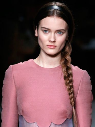 <p>The simple side plait is back making us very, very happy! At Valentino the models wore theirs with centre partings topped with flat black Alice bands in the centre of the head. Effortless elegance at its best.</p>
<p>To get the look style your plait loosely at the top, getting tighter towards the bottom and secure with a clear elastic. Ensure a high-shine finish with some <a title="http://www.tesco.com/groceries/Product/Details/?id=276825137" href="http://www.tesco.com/groceries/Product/Details/?id=276825137" target="_self">L'Oréal Paris Elnett So Sleek</a>, £6.63. </p>