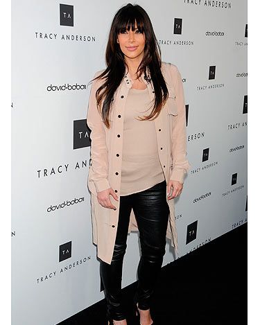 Is this Kim Kardashian's best maternity look yet? Although she's been spotted in a few unflattering outfits recently we think she looked super sleek at the Tracy Anderson flagship studio opening in California yesterday. The beige top and leather trousers combo with black courts did wonders for her figure, while her locks looked luscious. 