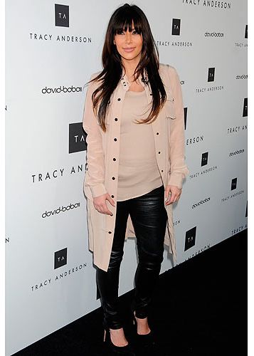 Is this Kim Kardashian's best maternity look yet? Although she's been spotted in a few unflattering outfits recently we think she looked super sleek at the Tracy Anderson flagship studio opening in California yesterday. The beige top and leather trousers combo with black courts did wonders for her figure, while her locks looked luscious. 