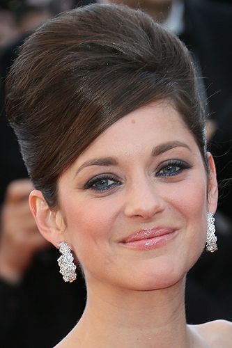 <p>Channelling classic Cannes glamour, French screen star, Marion Cotillard showed off the ultimate beehive on the red carpet. Her makeup made things modern, with blue eyeliner on her lower lids and nude gloss on her lips. Stunning.</p>
<p><strong>Get the look</strong> with a bit of backcombing and a lot of <a title="http://www.beautybay.com/haircare/sexyhair/bigwhatateasebackcombinabottle/?pcrid=12485385563&gclid=CI-ore36prcCFeXItAodNzoAzA" href="http://www.beautybay.com/haircare/sexyhair/bigwhatateasebackcombinabottle/?pcrid=12485385563&gclid=CI-ore36prcCFeXItAodNzoAzA" target="_blank">Sexy Hair Big What A Tease Backcomb In A Bottle</a>, £11.66</p>