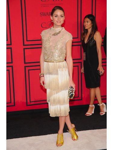 <p>Olivia Palermo looked as stylish as ever in a divine Dennis Basso Spring 2013 fancy fringed frock - we're guessing she was inspired by all that flapper fashion in The Great Gatsby! But, for us, it was all about those eclectic acessories; think Sergio Rossi clutch and Zara lace up slingback boots for an update on a classic style.</p>