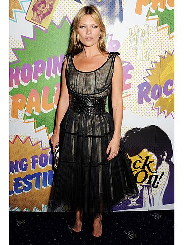 <p>Kate Moss stole the spotlight at The Hoping Foundation Presents 'Rock On' Benefit Evening For Palestinian Refugee Children in London yesterday. The model took the 'Rock On' theme seriously by wearing a gold dress with black tulle overlay, clinched in at the waist by a black leather belt. She finished off her look with black courts and a leopard print clutch. A flick of black eyeliner and un-styled hair added to the rock theme. We'd expect nothing less from you Kate.</p>