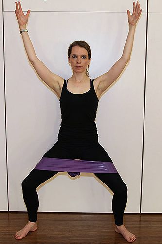 <p><strong>Works:</strong> Inner thighs and bottom<br /><br />Tie a resistance band around the mid thighs to allow you to stand in a wide squat making sure that your knees are in line with the second and third toe of each foot to avoid twisting of the knee. Hands on hips.<br /><br />Draw the bottom in, press heels into the ground and pulse for 10 repetitions and then lift heels and pulse for 10. Then alternate left heel and right heel for 20.</p>
