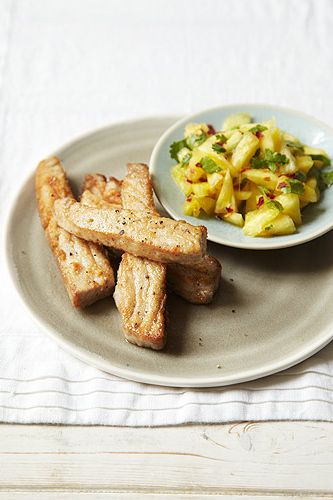 <p>238 calories</p>
<p><em>The bold flavours of the pineapple salsa complement the tuna in this dish.</em></p>
<p><strong>Serves:</strong> 2 </p>
<p><strong>Preparation time:</strong> 10 minutes </p>
<p><strong>Cook time:</strong> 5 minutes</p>
<p><strong>Ingredients:</strong></p>
<p>1 x 225g (8oz) can pineapple chunks in juice, drained and chopped into small chunks (106 cals)</p>
<p>¼ tsp chilli flakes </p>
<p>1 small handful of fresh coriander, finely chopped (3 cals)</p>
<p>1 tsp lemon juice</p>
<p>2 x 200g fresh tuna steaks (272 cals)</p>
<p>1 level tbsp plain (all-purpose) flour, seasoned with salt and freshly ground black pepper (68 cals)</p>
<p>1 tsp olive oil (27 cals)</p>
<p><strong>Preparation:</strong></p>
<p>Combine the chopped pineapple, chilli flakes , coriander and lemon juice in a small bowl and set aside while you prepare the tuna.</p>
<p>Cut each tuna steak into four strips and toss in the seasoned flour until just coated.</p>
<p>Heat the olive oil in a frying pan over a high heat. The oil needs to be glimmering hot before adding the tuna. Fry the tuna for just 1–2 minutes, turning once. </p>
<p>Pile the salsa onto two serving plates, arrange the tuna strips on top and serve.</p>