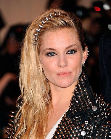 <p>The Met Gala's punk theme brought all sorts of ear cuffs to the red carpet. Sienna gave her rock look some extra edge with a host of silver ear cuffs to go with her silver spikes. 