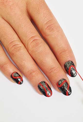 <p>Take a striping brush dipped in red nail polish and paint on a "S" shaped squiggly line from cuticle to tip. Paint on different shaped curved red outlines on the rest of the nails, some from tip to cuticle others from side to side.</p>