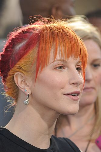 <p>For the 2010 MTV Video Music Awards, Hayley tried out another new style. With her fringe still in place, we love this plaited updo which revealed her multi-layered locks.Who else can wear red, yellow and orage so well?</p>