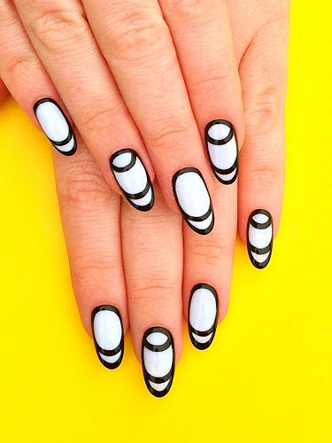 <p>Have fun with monochrome thanks to this amazing design by The Illustrated Nail. Follow these simple steps to help you create these psychedelic talons.<br /><br />1. Paint a white coat over your whole nail – this only works with longer talons, so avoid if you're keeping your claws short.</p>
<p>2. Using a black nail art pen, carefully circle your entire nail.</p>
<p>3. With the pen, draw half-moon crescents across the top of all your nails, and along the bottom of every other nail.</p>
<p>4. Finish with a clear topcoat and voila!</p>