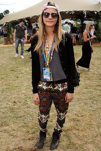 <p>Model of the moment (when <em>will</em> it be time stop saying that?) Cara Delevingne rocked her trademark tomboyish off-duty look in jazzy patterned pants by MinkPink, a leather jacket, hi-tops and a backwards baseball cap. She even managed to make her lanyards look like a fashion statement.</p>