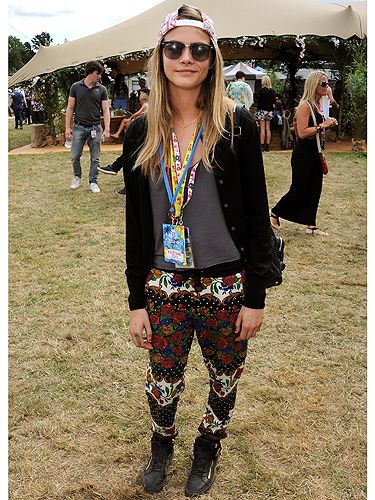 <p>Model of the moment (when <em>will</em> it be time stop saying that?) Cara Delevingne rocked her trademark tomboyish off-duty look in jazzy patterned pants by MinkPink, a leather jacket, hi-tops and a backwards baseball cap. She even managed to make her lanyards look like a fashion statement.</p>