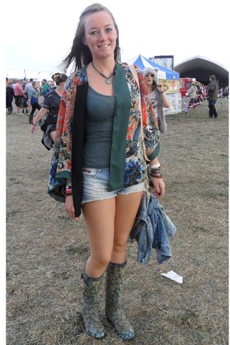 <p>The oriental trend was going strong for Katie's festival fashion as she livened up a simple denim shorts and vest combo with a beautiful cover up in an array of muted tones. Even her wellies followed the Asian invasion theme.</p>