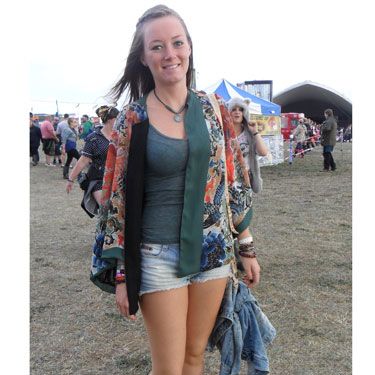 <p>The oriental trend was going strong for Katie's festival fashion as she livened up a simple denim shorts and vest combo with a beautiful cover up in an array of muted tones. Even her wellies followed the Asian invasion theme.</p>