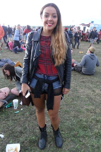 <p>We found a punk fashion lover in the fields of Reading as Kate, 18 stepped out in a tartan top worn under a leather jacket. To continue the theme she wore sheer cycling shorts under her denim hot pants toughening things up further with biker boots.</p>