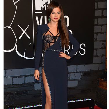 Selena Gomez went for a raunchy Versace dress with a thigh-high split and underwear-as-outerwear glimpse of a basque.