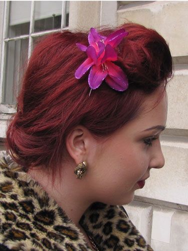 We love this rocking rich shade of red, and the lily behind the quiff gives it an elegant touch. 