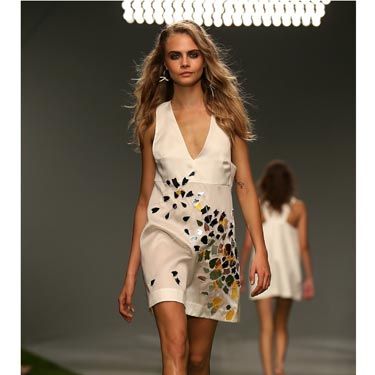 <p>Cara closed the show in this mosaic-embellished cream dress. </p>