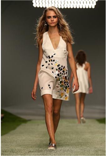 <p>Cara closed the show in this mosaic-embellished cream dress. </p>