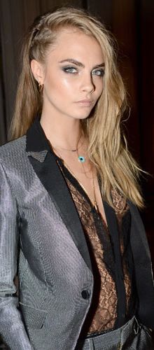 <p>Cara took the trouser suit to a new level, pairing it with a sexy lace plunge shirt at the W Magazine party which celebrated Cara's September cover. </p>